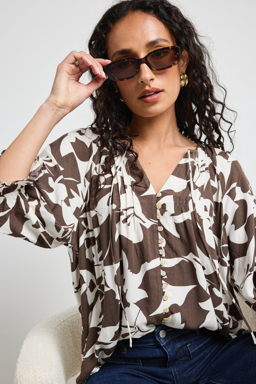 Mode wears a chocolate pattern print blouse top