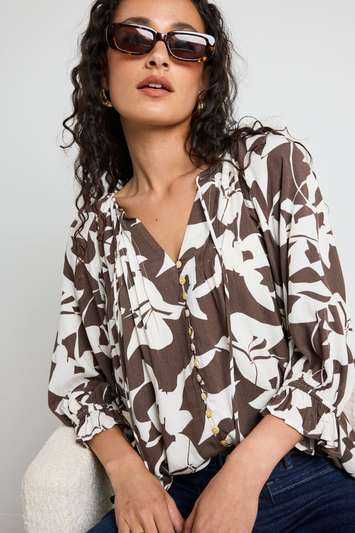 Mode wears a chocolate pattern print blouse top