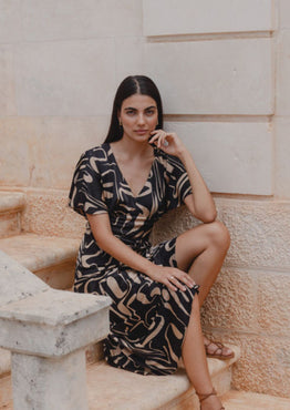 model wears a black beige patten maxi dress