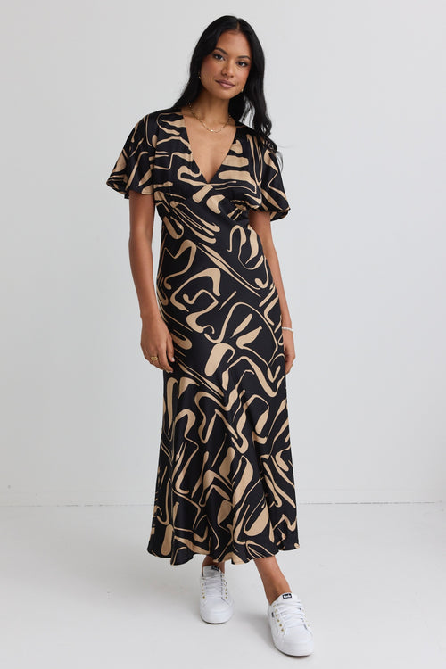 model wears a black beige patten maxi dress