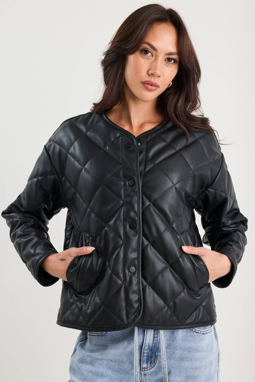 Woman wearing a black quilted jacket