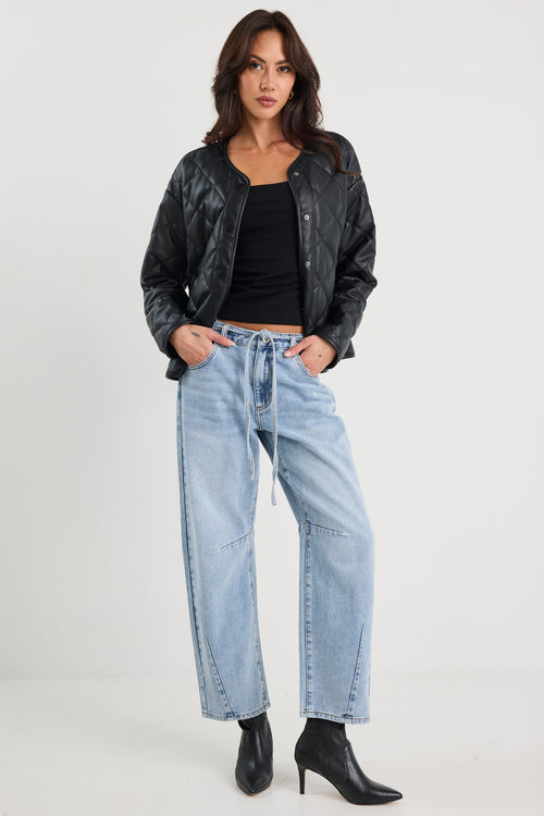 Woman wearing a black quilted jacket