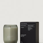 Candle and packaging of Ashley & Co on a light gray background