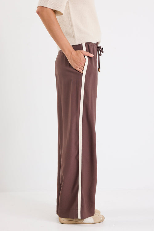 Brown pants with a white stripe on a white background