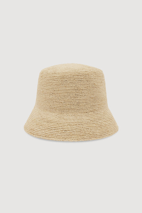 A light beige woven straw bucket hat, shown from the back against a solid light gray background.
