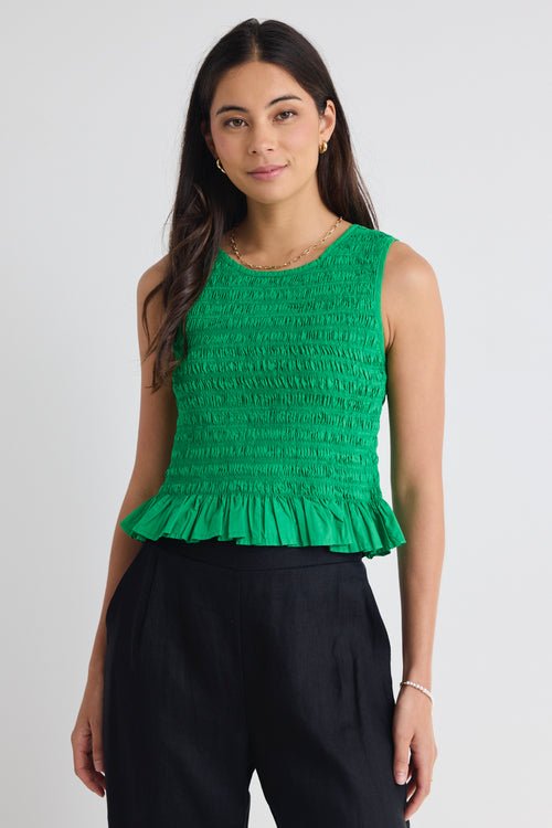 model wears a green crop top