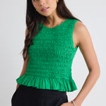 model wears a green crop top