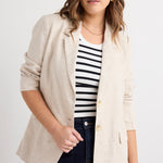 model wears a beige linen blazer