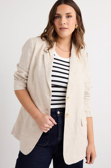 model wears a beige linen blazer