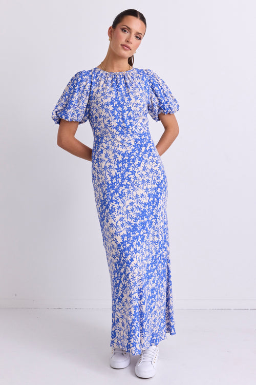 model wears a Blue Floral Puff Sleeve Bias Maxi Dress