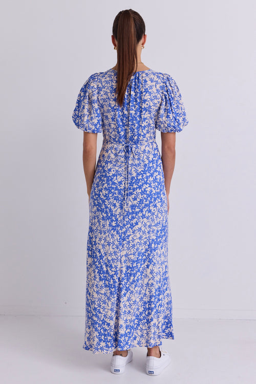 model wears a Blue Floral Puff Sleeve Bias Maxi Dress