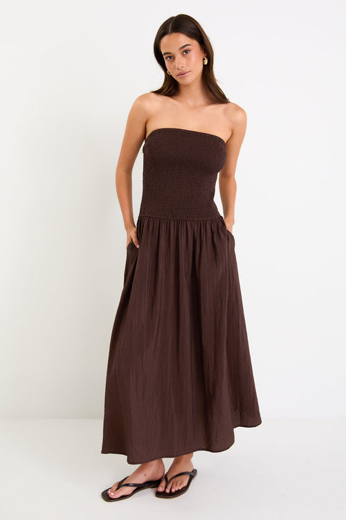 Woman wearing a brown dress
