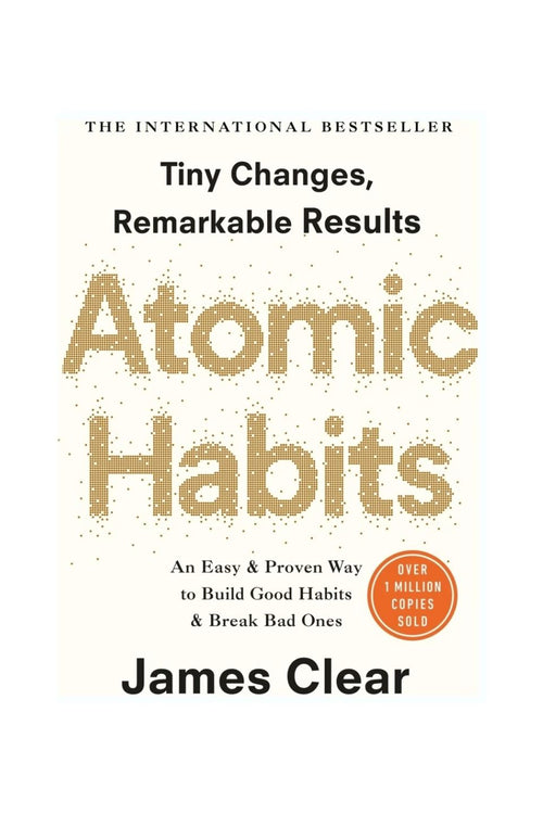 Book cover of 'Atomic Habits' by James Clear, featuring a cream background with gold glitter-style title text and black text, plus a small orange badge indicating over 1 million copies sold.