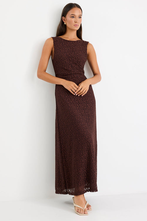 Woman wearing a brown lace maxi dress