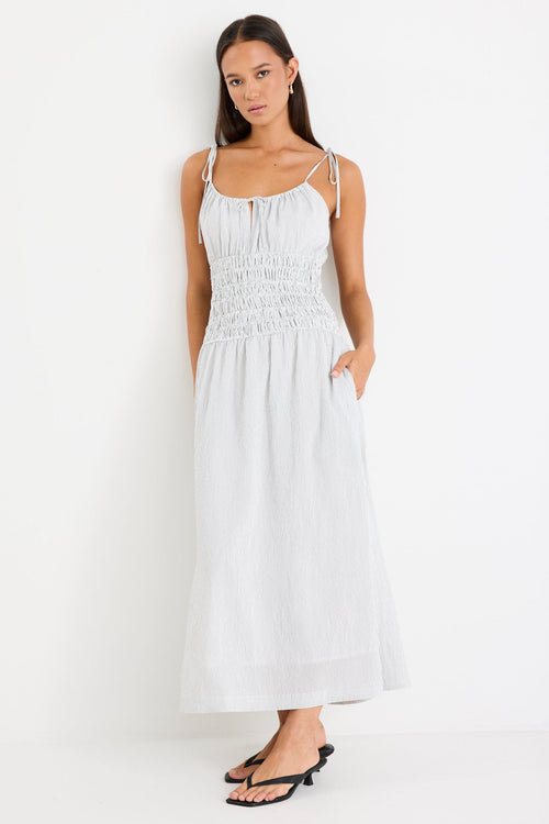 Woman wearing a black and white midi dress