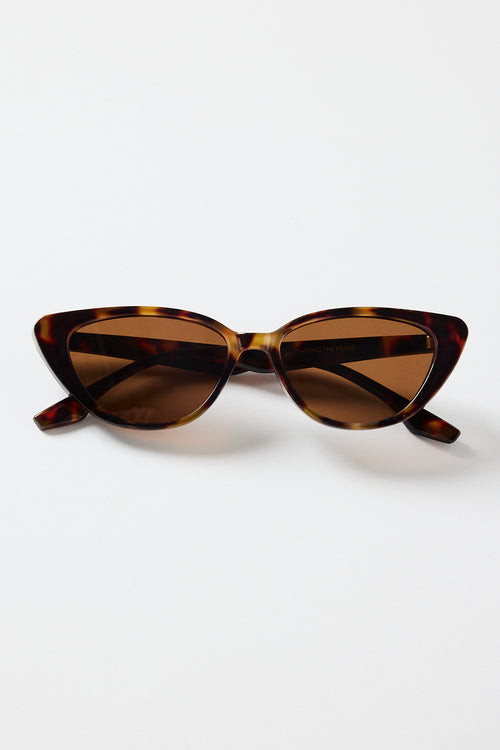 A pair of brown tortoiseshell cat-eye sunglasses with slim arms, photographed on a white background.