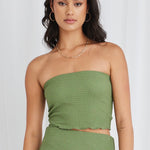 Model wearing green bandeau top and maxi skirt set