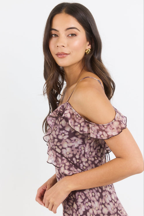 Woman wearing a floral dress on a white background