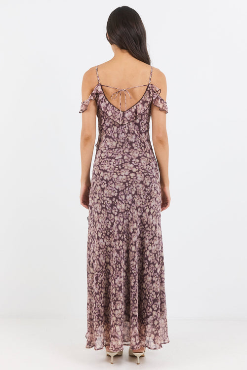 Woman wearing a floral dress on a white background