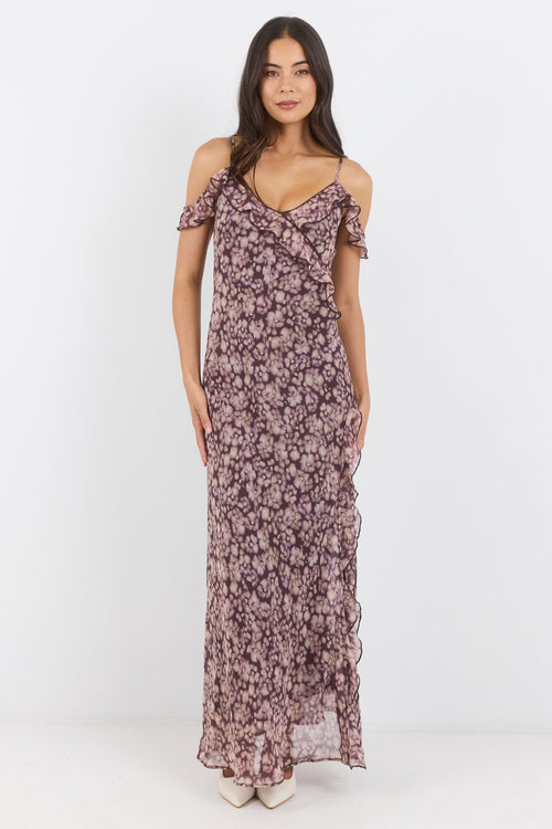 Woman wearing a floral dress on a white background
