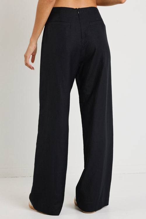 model wears a black linen pants