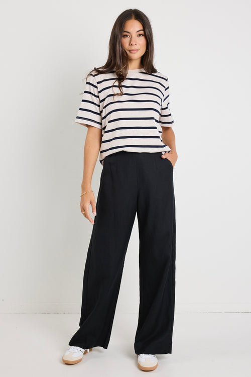 model wears a black linen pants