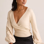 model wears a beige knit wrap cardigan