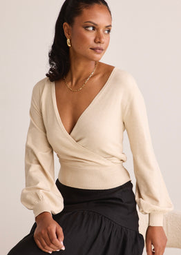model wears a beige knit wrap cardigan