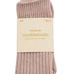Blush pink cosy ribbed socks in Stories Be Told packaging, made with soft plush fibres.