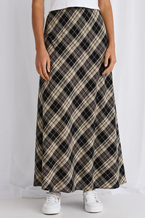 model wears a black gingham maxi skirt