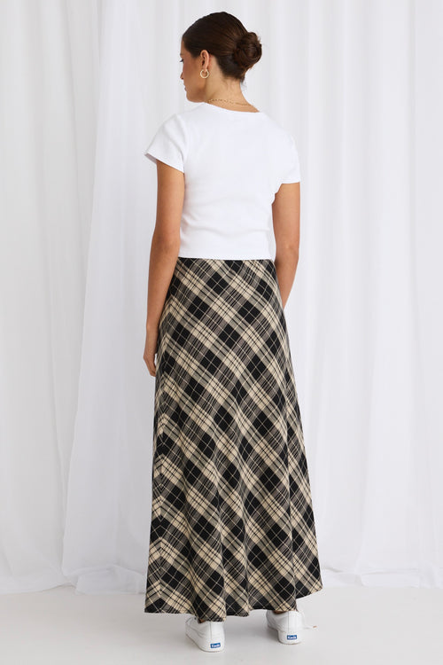 model wears a black gingham maxi skirt