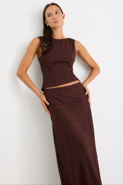 Woman wearing a chocolate lace maxi skirt