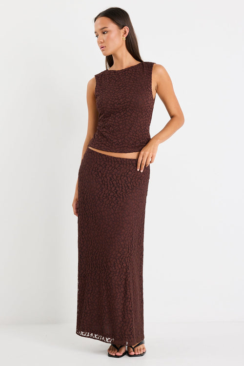Woman wearing a chocolate lace maxi skirt