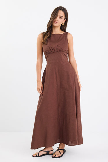 A chocolate brown dress with strappy sleeves and a shirred back for a flattering fit. Made from a breathable blend of 45% Linen and 55% Cotton, and fully lined for comfort.