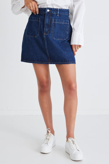 model wears a denim mini skirt