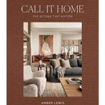 The front cover of the book 'Call It Home: The Details That Matter' by Amber Lewis. The cover features a textured brown border with the title in white serif font and a central photograph of a cozy, modern living room.