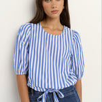 woman wearing a blue white stripe top and blue jeans