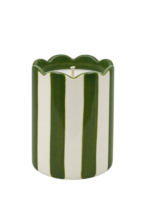 A ceramic candle with a fluted scalloped rim, featuring vertical stripes of dark green and cream white, with a single white wick at the top, isolated on a white background.