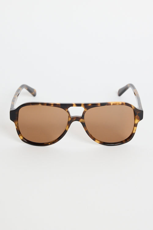 Tortoiseshell aviator sunglasses with warm brown tinted lenses, photographed on a white background.