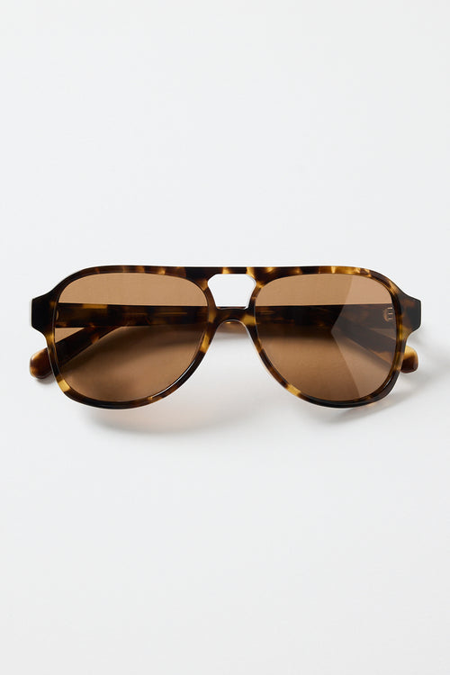 Tortoiseshell aviator sunglasses with warm brown tinted lenses, photographed on a white background.