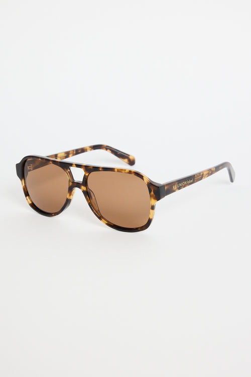 Tortoiseshell aviator sunglasses with warm brown tinted lenses, photographed on a white background.