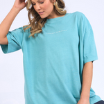 model wears oversized blue shirt