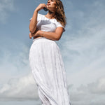 model wears a white maxi skirt