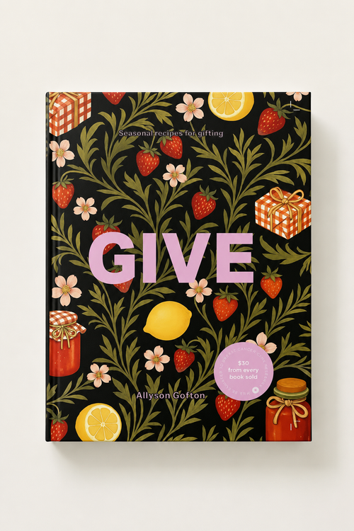 The book cover of 'GIVE' by Allyson Gorton, featuring a black background decorated with green leaves, red strawberries, yellow lemons, pink flowers, and orange gift boxes, with the title 'GIVE' in large pink letters.