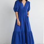 model wears a blue maxi dress