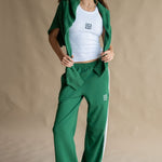 model wears a Green Track Pant