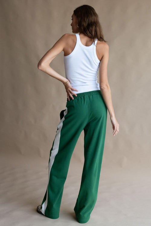 model wears a Green Track Pant