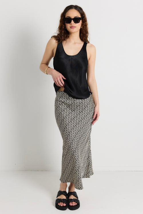 model wears a black print maxi skirt