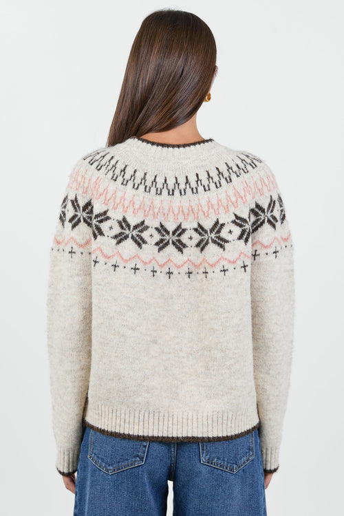 Woman wearing a cream knit