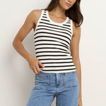 model wears a white black stripe tank top